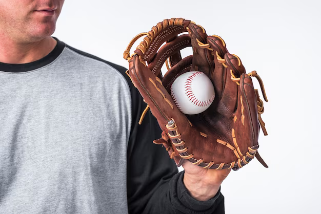 Man holding a baseball in his glove