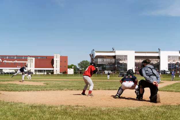 Side view of kids playing baseball outdoors